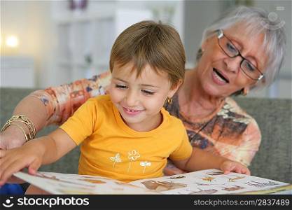 Grandmother reading with toddler