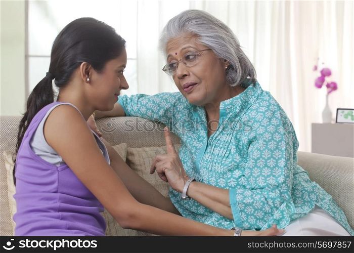 Grandmother talking to her granddaughter