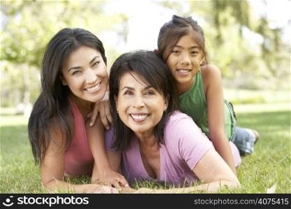 Grandmother With Daughter And Granddaughter In Park