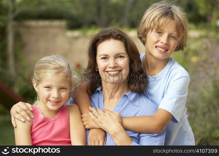 Grandmother With Grandchildren In Garden