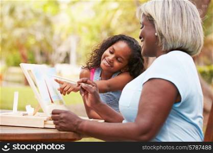 Grandmother With Granddaughter Outdoors Painting Landscape