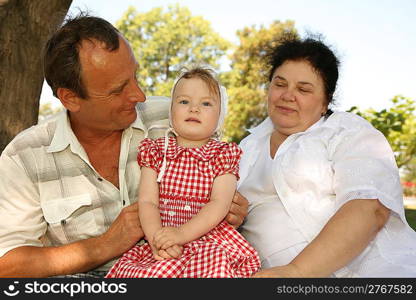 Grandmother with grandfather and granddaughter