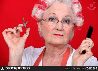 grandmother with scissors and haircurlers