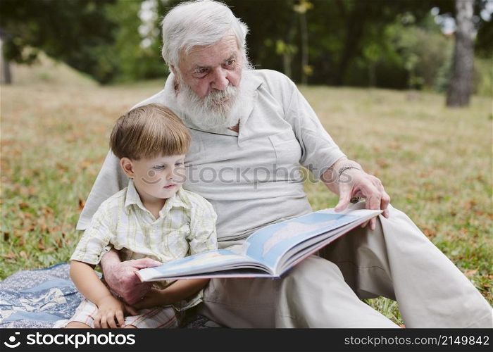 grandpa grandson park reading