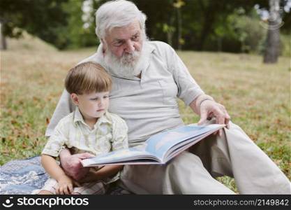 grandpa grandson park reading