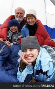 Grandparents and grandchildren (7-12) in tent (portrait)