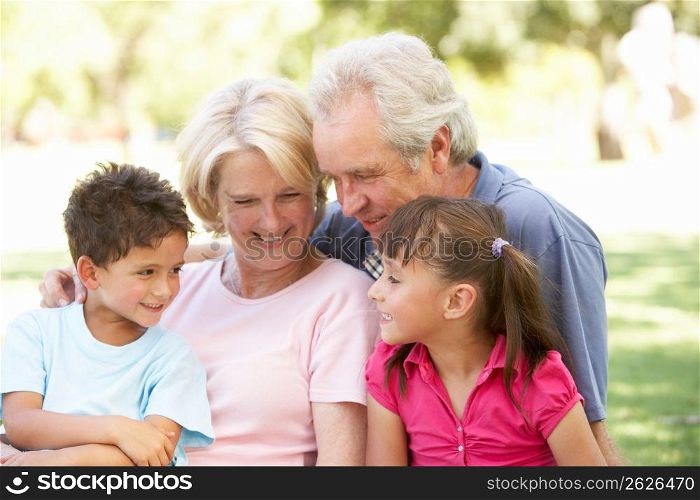 Grandparents And Grandchildren Enjoying Day In Park