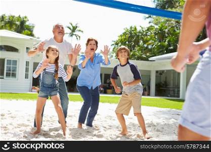 Grandparents And Grandchildren Playing Volleyball In Garden