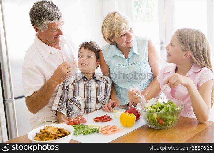 Grandparents And Grandchildren Prepare A meal,mealtime Together
