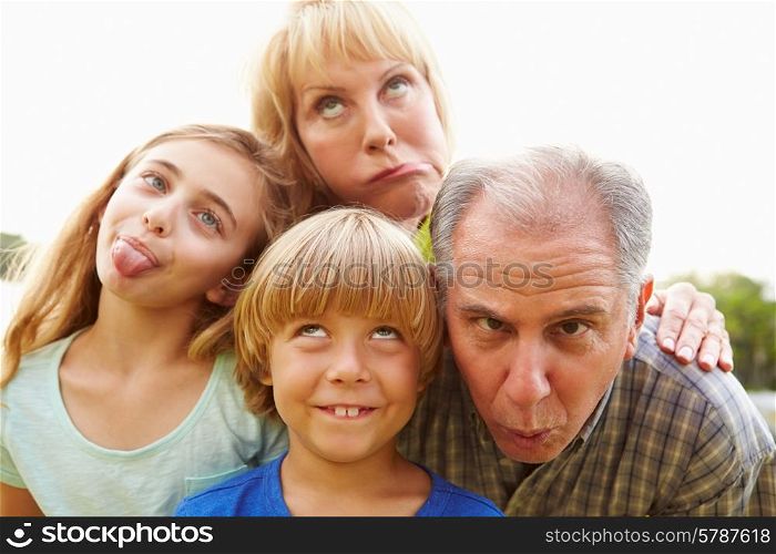 Grandparents And Grandchildren Pulling Funny Faces