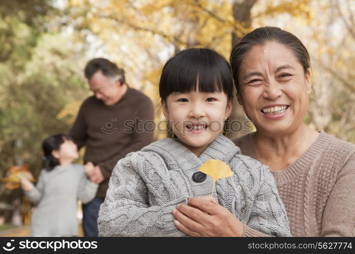 Grandparents and granddaughters in park