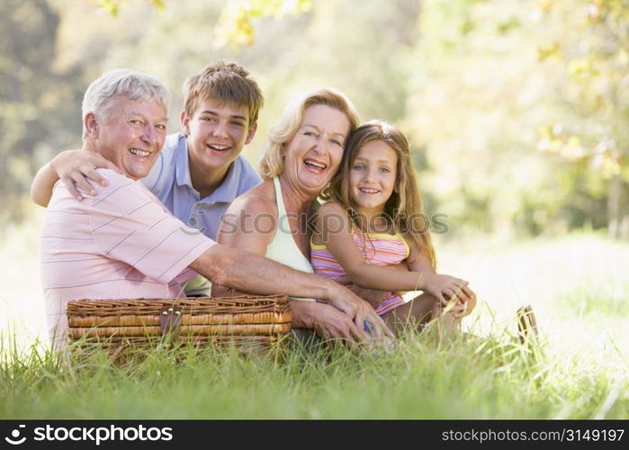 Grandparents having a picnic with grandchildren.