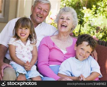 Grandparents laughing with grandchildren.