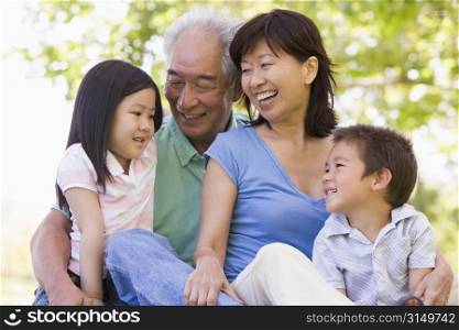 Grandparents laughing with grandchildren.