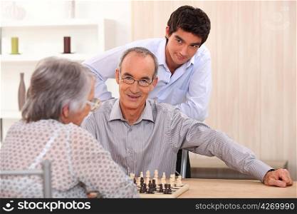 Grandparents playing chess