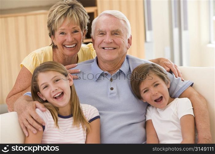 Grandparents posing with grandchildren.