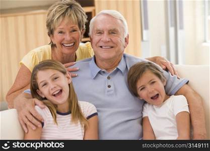 Grandparents posing with grandchildren.