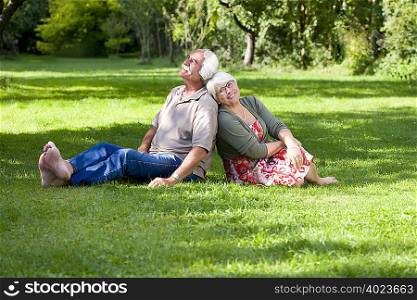 Grandparents relaxing in the garden