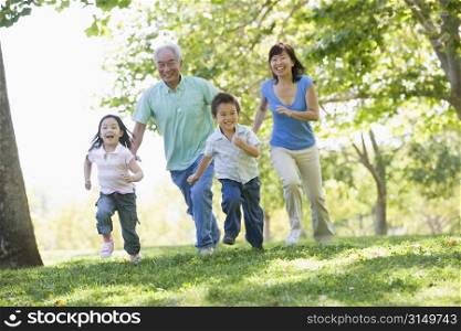 Grandparents running with grandchildren.