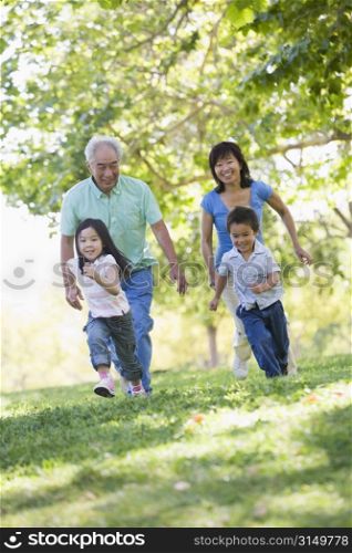 Grandparents running with grandchildren.