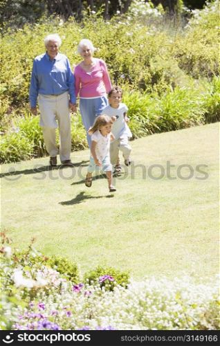 Grandparents walking with grandchildren.