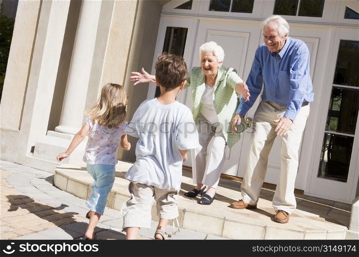 Grandparents welcoming grandchildren.