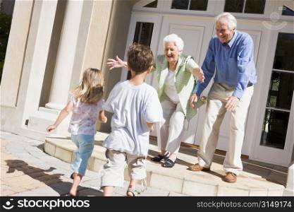 Grandparents welcoming grandchildren.