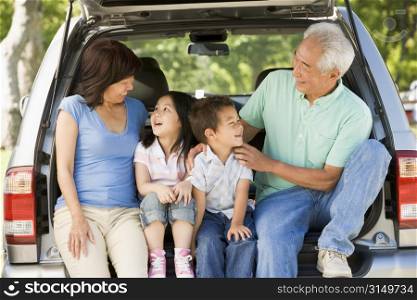 Grandparents with grandkids in tailgate of car
