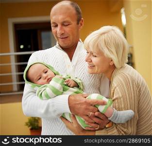 Grandparents with his grandchild