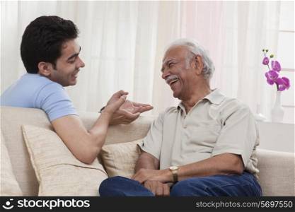 Grandson and grandfather talking