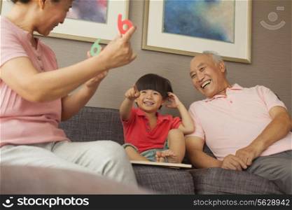 grandson playing with grandparents