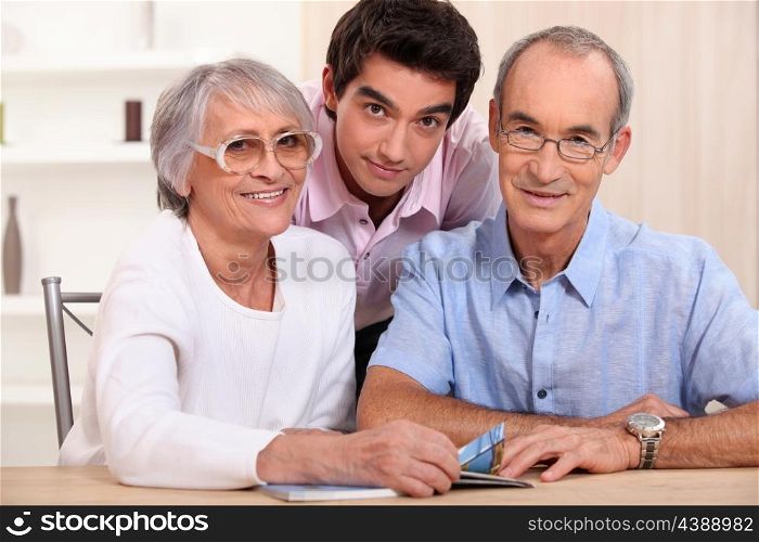 Grandson posing with his grandparents