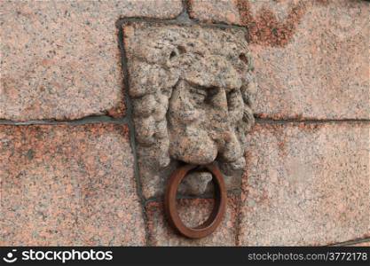 granite lion?s head with an iron ring