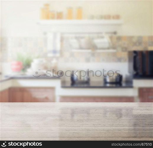 granite table top and blur of modern kitchen interior as background
