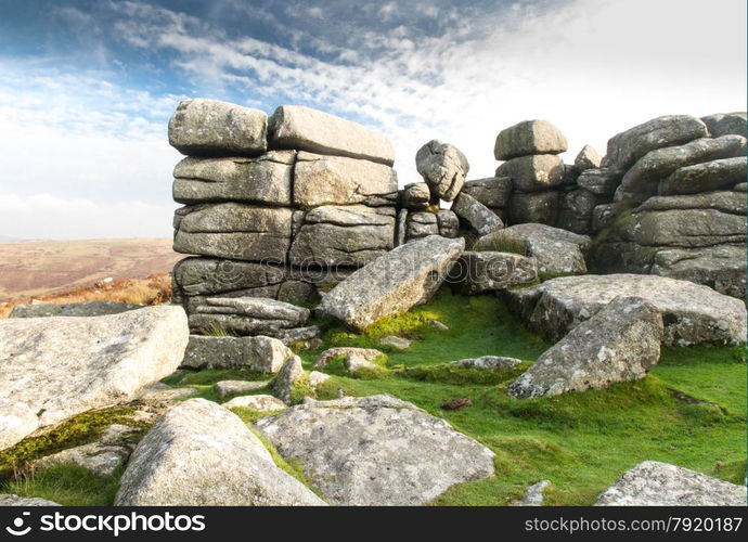 Granite weathered stone outcrops of Combestone Tor. Dartmoor National Park, Devon, England, United Kingdom.