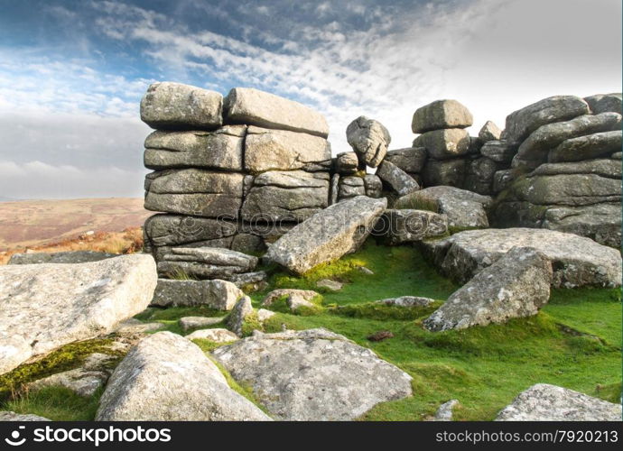 Granite weathered stone outcrops of Combestone Tor. Dartmoor National Park, Devon, England, United Kingdom.