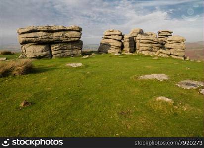 Granite weathered stone outcrops of Combestone Tor. Dartmoor National Park, Devon, England, United Kingdom.