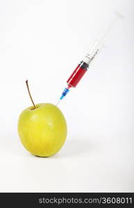 Granny smith apple being injected over white background