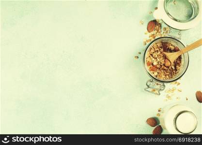 Granola and almond milk. Healthy eating concept. Copy space background, top view flat lay overhead