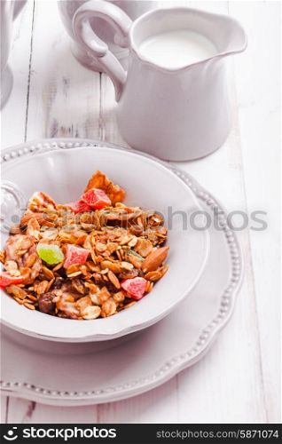 Granola and milk on the tray, for breafast