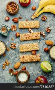Granola bar and ingredients.Homemade rustic granola bars with dried fruits and nuts.Healthy sweet dessert. Cereal granola bars