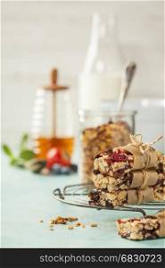 Granola bar on a blue rustic table. Healthy energy snack