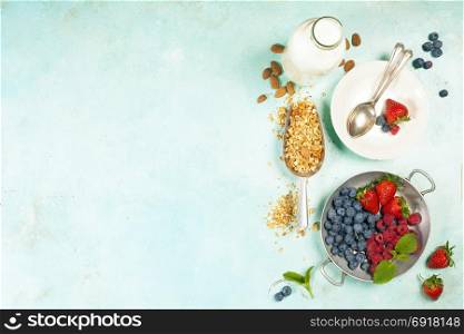 Granola. Breakfast set with granola, almond milk and berries. Healthy eating concept
