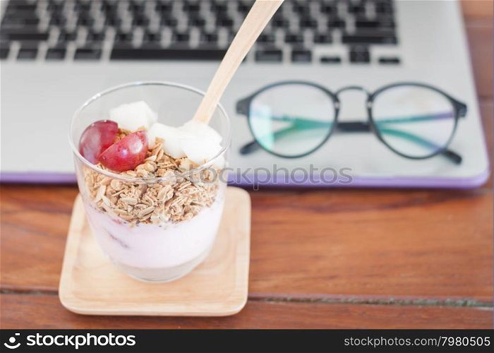 Granola with fruits on work station, stock photo