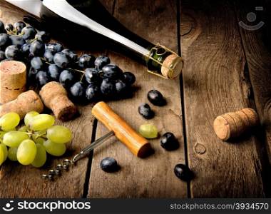 Grape and wine on a wooden table
