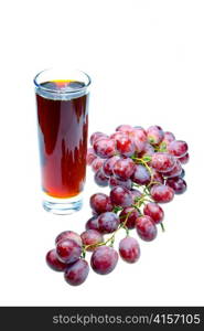 Grape cluster and juice in glass