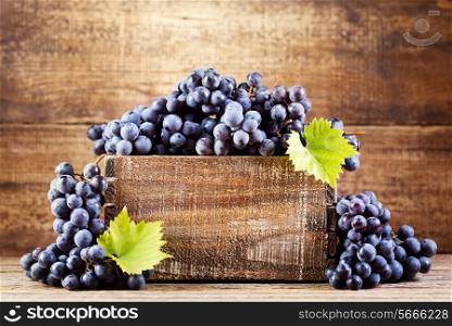 grape in wooden box on wooden background