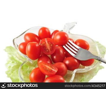 grape tomatoes in a dish on white background