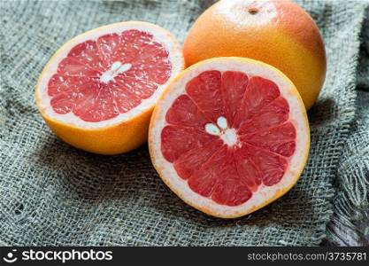 Grapefruit over rustic background, selective focus
