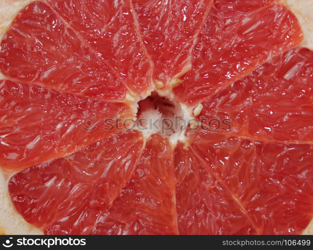 grapefruit red cut by pieces. grapefruit bright red and cut by segments